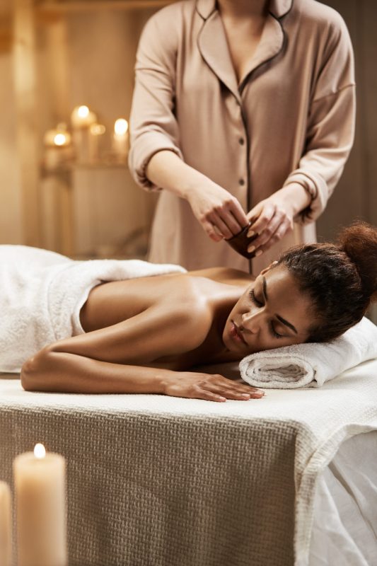 tender-african-woman-relaxing-enjoying-healthy-spa-massage-with-oil tender-african-woman-relaxing-enjoying-healthy-spa-massage-with-oil